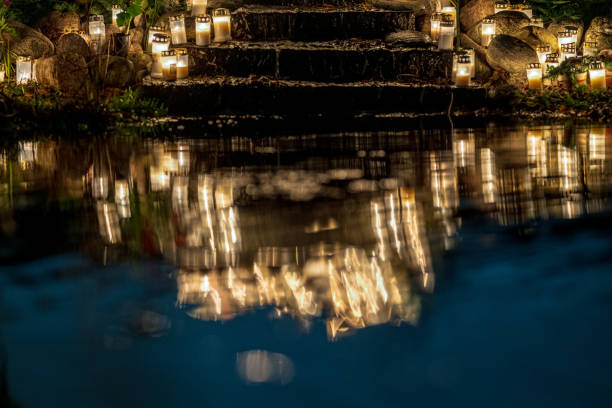 istock Grave candles in a cemetery at all saints eve.. 2194074613