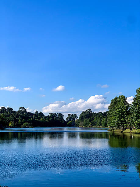 istock Lake with reflection of clouds is a blue sky 2194074705