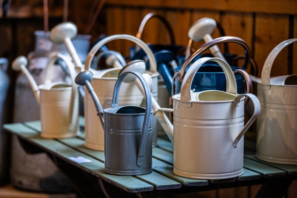 Metal watering cans for sale.