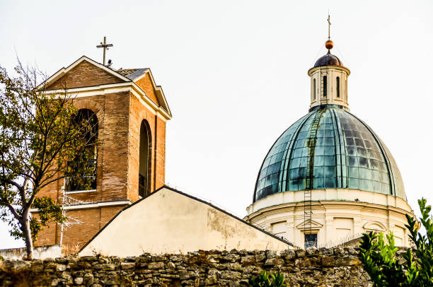 A church with a bell tower and a dome on top