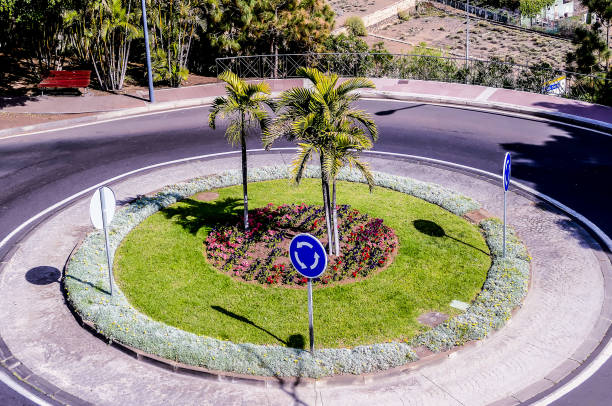 istock A round flower bed with a blue sign in the middle 2194076180