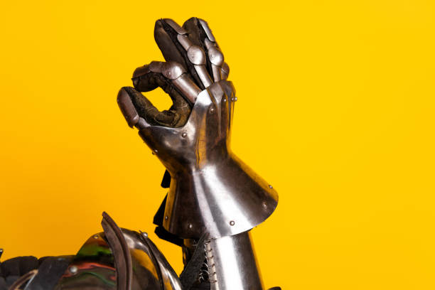 istock Metal gauntlet displayed against a vibrant yellow background representing medieval armory and historical fighting culture 2194076269