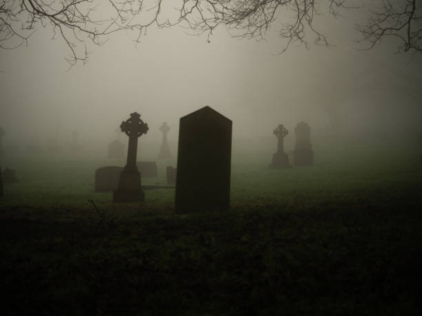 istock Eerie Graveyard in thick fog and mist 2194077538