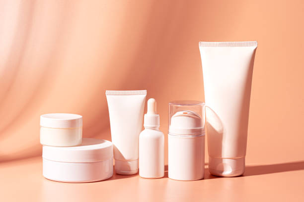 istock White cosmetic products containers on pink 2194077547