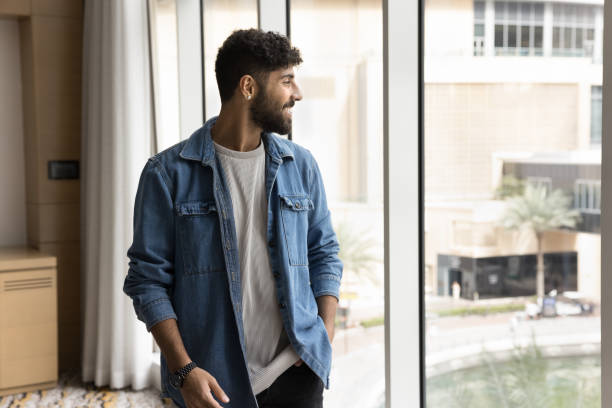 istock Arabian staff member standing in office room looking out window 2194079048