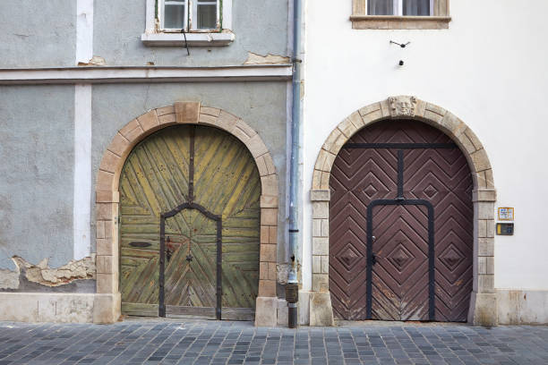 Large arch doorways, cobblestone Street, Budapest hungary,
