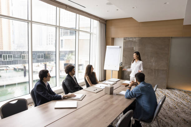 istock Young Asian business trainer make flip chart presentation 2194080174