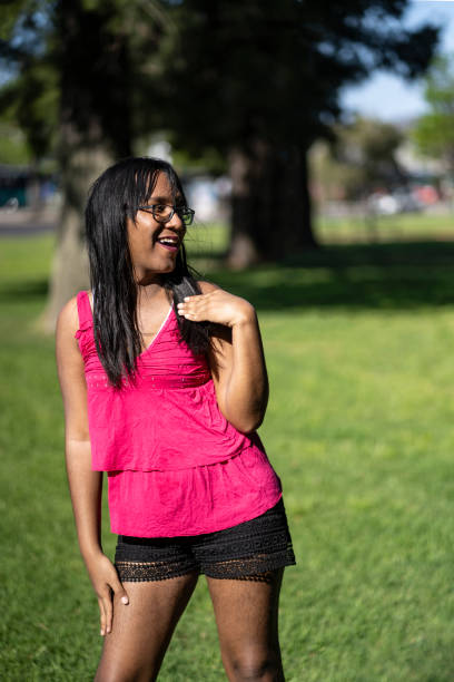 istock Latin transgender woman dancing sensually in a park 2194082569