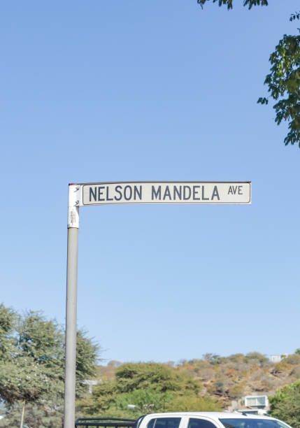 Nelson Mandela Avenue in Windhoek at Khomas Region, Namibia, with stickers visible on the street name pole.