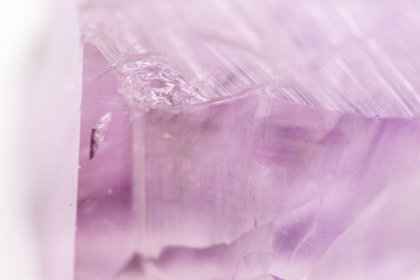 Amethyst crystal raw cut close up shot . High quality photo