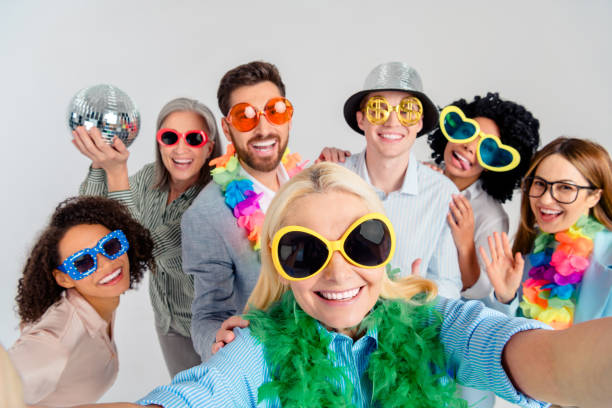 istock Multigenerational team celebrating together in a fun and playful atmosphere with props and sunglasses 2194086830