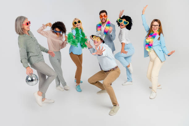 istock Group of diverse professionals celebrating together in a fun playful team activity 2194086834