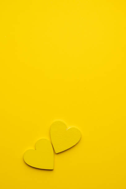 istock Yellow Hearts on Yellow Background 2194097899