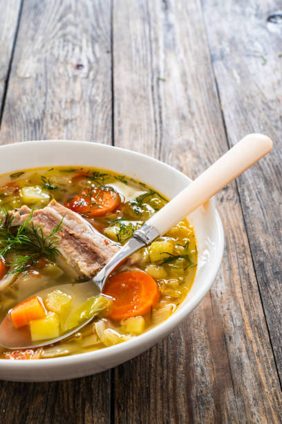 istock Cabbage soup with pork ribs and boiled potatoes served on wooden table 2194102464