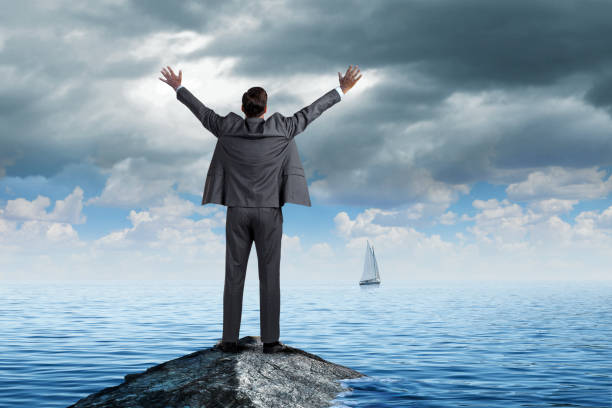 istock Man Stranded Tries To Get Attention Of Ship That Has Sailed 2194109322
