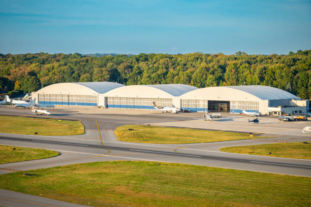 Airplane hangar with airplane. This is entirely 3D generated image.