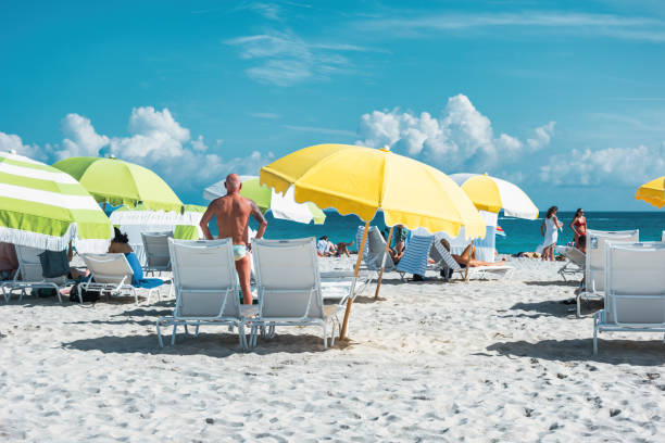 People enjoy South Beach in Miami Beach, Florida USA, on a sunny day.