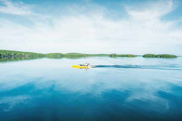 Man is boating in Biscayne National Park, Florida, USA on a sunny morning.