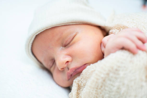 istock newborn baby, 17 days old, sleeping. 2194113984
