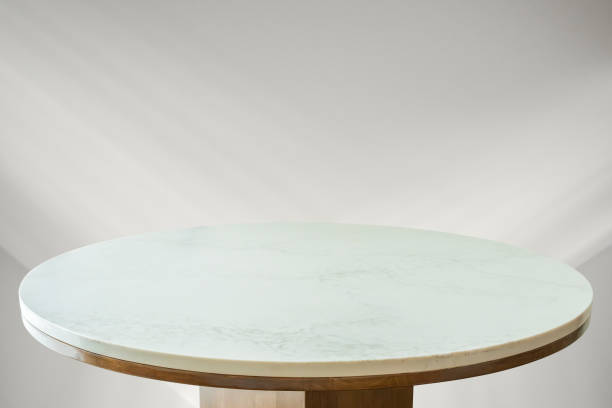 istock Round marble table top with abstract shadow drop on white wall background for mockup product display 2194116637