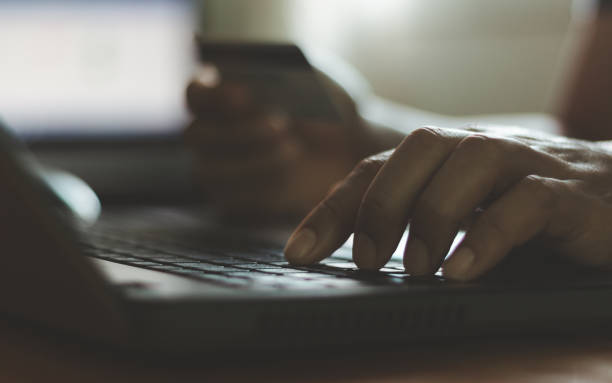 istock Online shopping, e-commerce concept. Man hand holding credit card and using laptop. Businessman working, typing, texting for online payment, make purchase on internet. Business financial technology. 2194121449