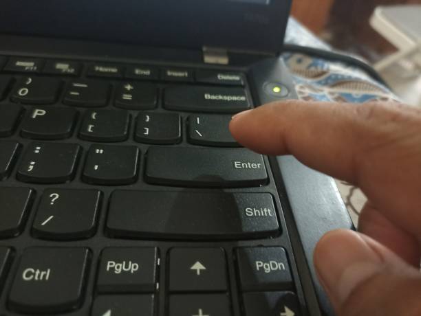 istock The ENTER button is pressed with your finger. Finger pressing ENTER on Keyboard 2194125789