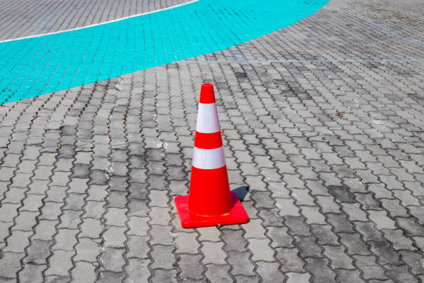 istock Traffic cone on paving stones. Traffic restriction 2194129350