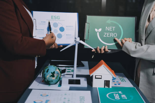 istock Carbon offset price report CO2 emission. Future growth Net zero waste in ESG ethical SME office protect climate change global warming social issues project. Group of asia people Eco friendly SDGs plan 2194133695