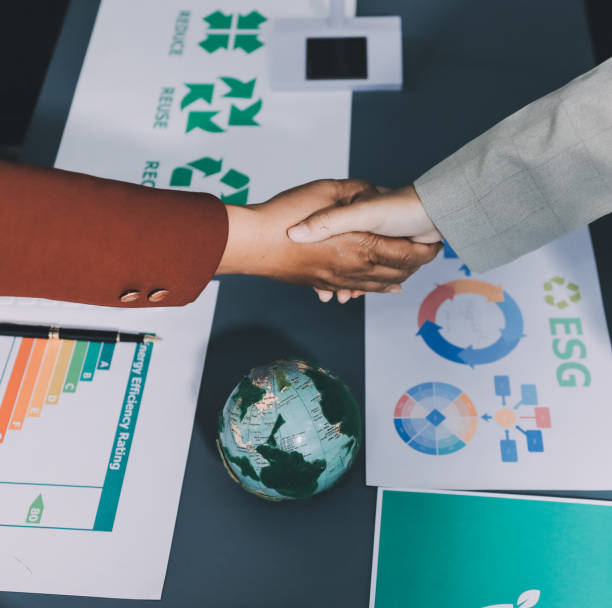 istock Carbon offset price report CO2 emission. Future growth Net zero waste in ESG ethical SME office protect climate change global warming social issues project. Group of asia people Eco friendly SDGs plan 2194133696