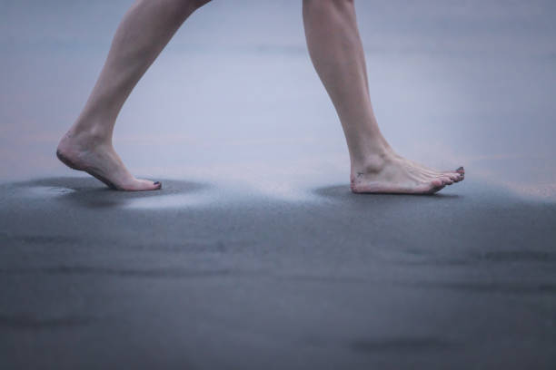 A woman is walking on beach after swimming.Canggu beach - Bali Island - Indonesia.