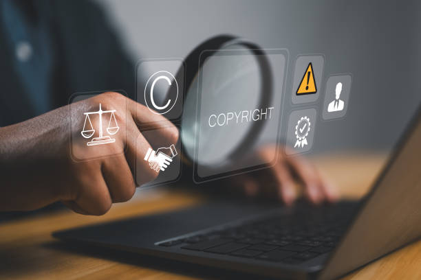 istock Copyright or patent concept. Author rights and patented intellectual property. copyleft trademark license. Businessman use laptop with copyright icon on virtual screen. 2194136701