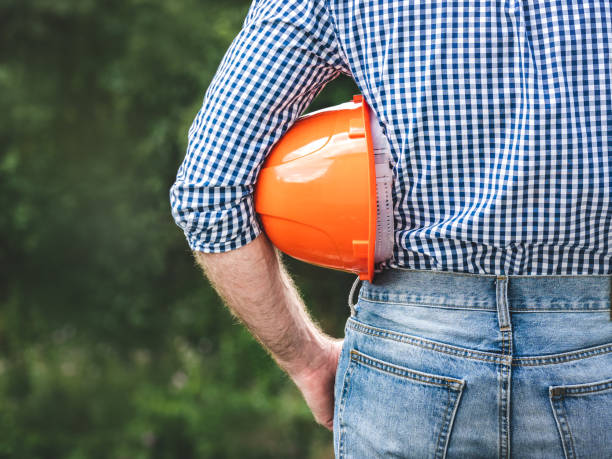 istock Attractive man in work clothes with a protective helmet 2194140142