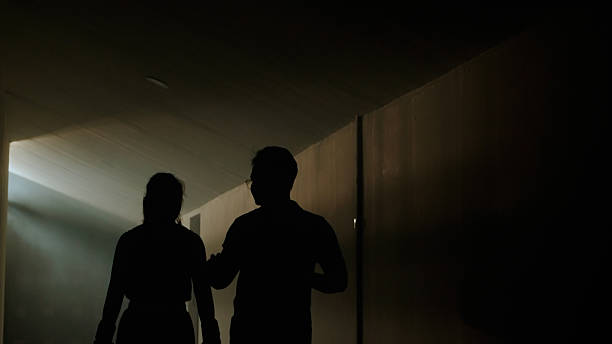 Boxer and coach walking and talking after fight match