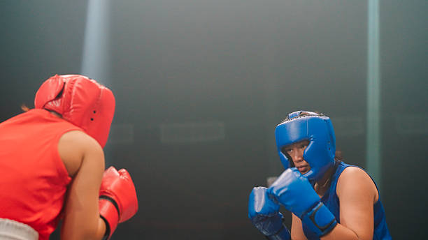 istock Two women boxer boxing on boxing ring 2194144019