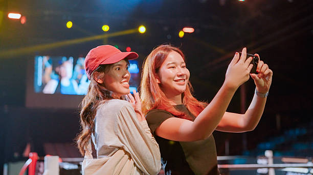 istock Asian friend go to watching boxing match 2194144073