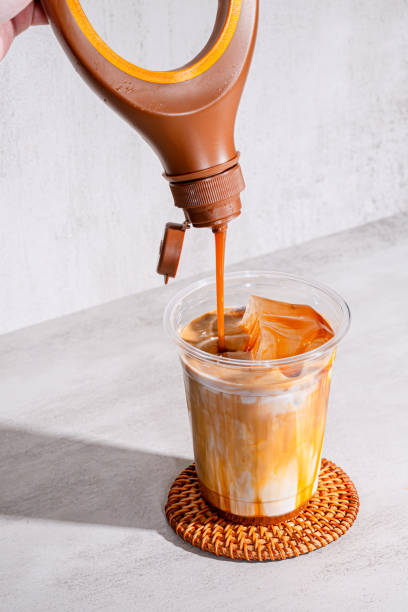 istock Indulgent Iced Latte with Caramel Syrup Topping 2194144317
