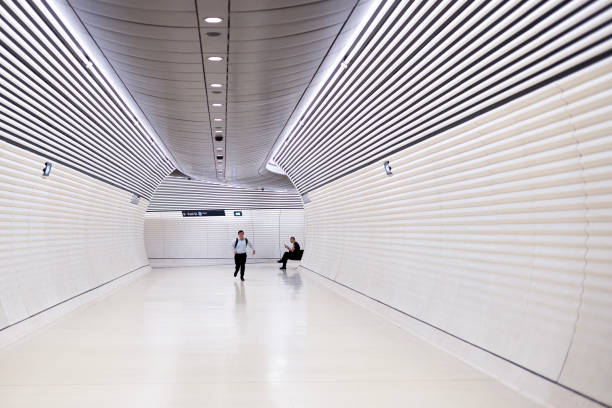 Rome, October 28, 2024, passage at the main train station: A street musician entertains passersby. A woman makes an exaggerated gesture to the music.