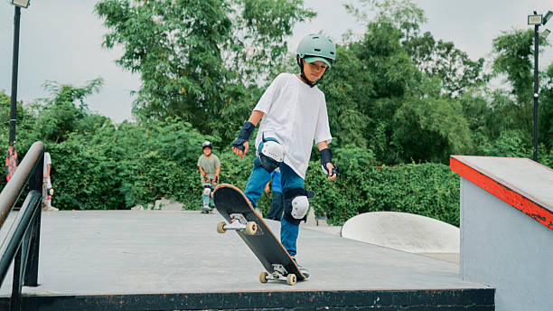 istock Skateboarder playing skate at skate park 2194145133