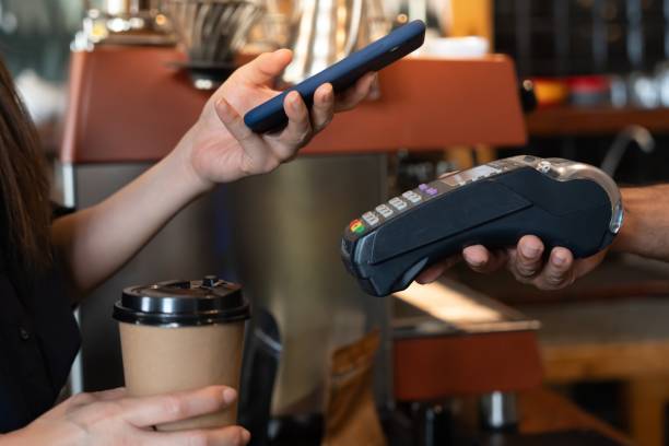 istock Woman use smartphone to scan QR code for order menu in cafe restaurant with a digital delivery. Choose menu and order accumulate discount. E wallet, technology, pay online, credit card, bank app. 2194145505