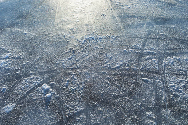 istock Ice hockey rink background or texture illuminated by sun rays, macro, top view 2194151091