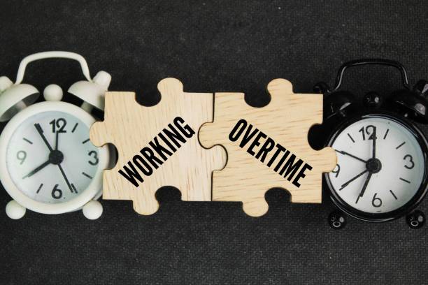 istock two hours and a puzzle with the word working overtime. any hours worked by an employee that exceed their normally scheduled working hours 2194153307