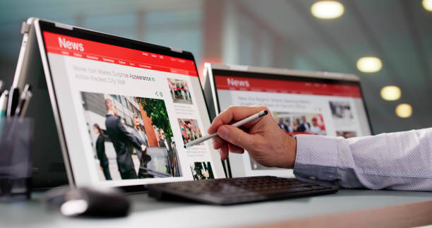 istock Watching News On Screen. Reading Newspaper Website 2194155292