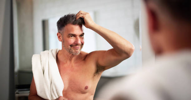 istock Happy Man Doing Hair Care Looking 2194155369