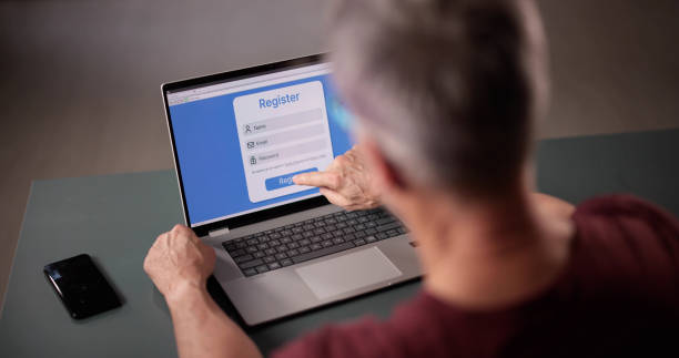 istock Businessman's Hand Filling Online Registration Form 2194155919