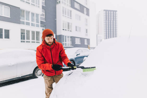 istock Man clean snow from the car in winter 2194160005
