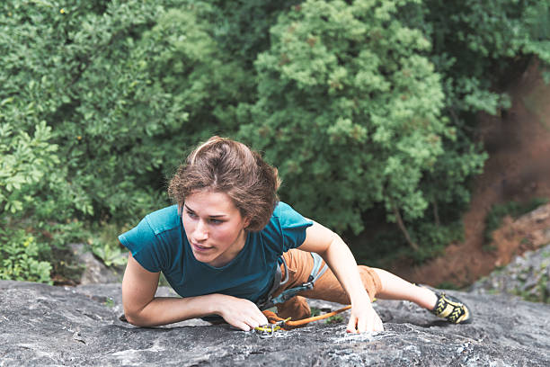 Sport climbing with a young caucasian woman