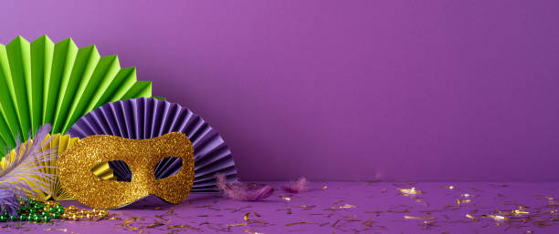 istock Festive Mardi Gras side view scene featuring a vibrant mask, colorful feathers, and decoration elements arranged elegantly 2194161578