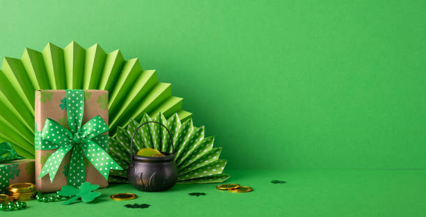 istock Festive setup with wrapped presents, shamrock decorations, and gold coins for St. Patrick's Day 2194161585