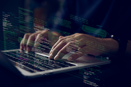 Hands Typing On Laptop With Programming Code On Screen Representing ...