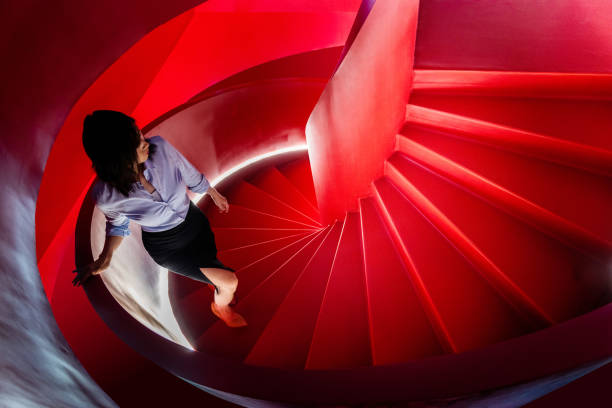 Women walk down the spiral stairs